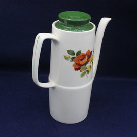 White thermos with floral design on a dark background