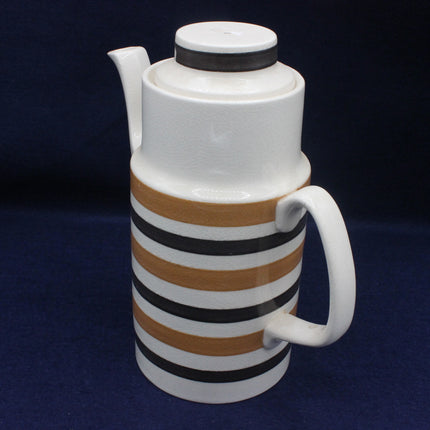 White thermos with brown and black striped design on a dark blue background