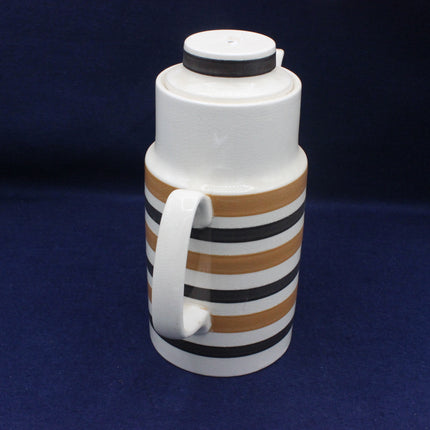 White thermos with brown and black stripes on a blue background