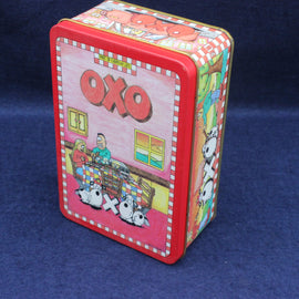 OXO vintage metal tin with colorful graphics on a blue background