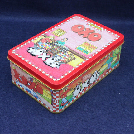 Colorful OXO tin box with cartoon characters on a blue background