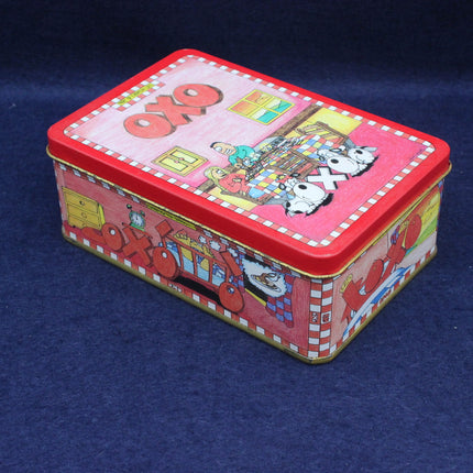 Colorful rectangular tin box with cartoon design on a blue background