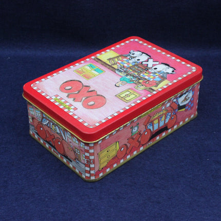 Rectangular tin box with cartoon characters on a blue background