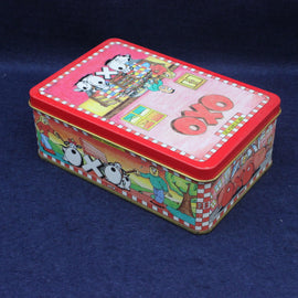 Colorful rectangular tin box with cartoon designs on a dark blue background