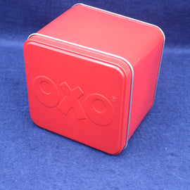 Red OXO tin box on a blue background