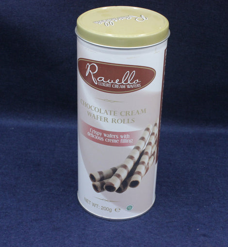 Canister of Ravello chocolate cream wafer rolls on a dark blue background