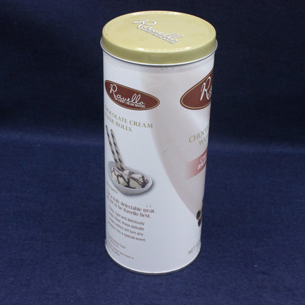 Canister of chocolate cream filled rolls with a gold lid on a blue background