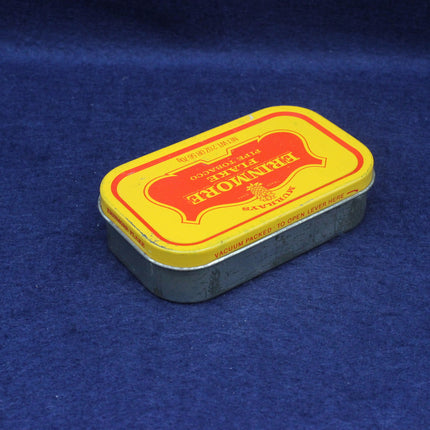 Small rectangular metal tin with yellow and red label on a blue background
