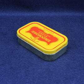 Small rectangular metal tin with a yellow label on a blue background