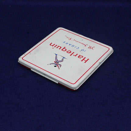 Harlequin playing card box on a blue background