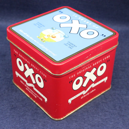 Red OXO tin can on a blue background