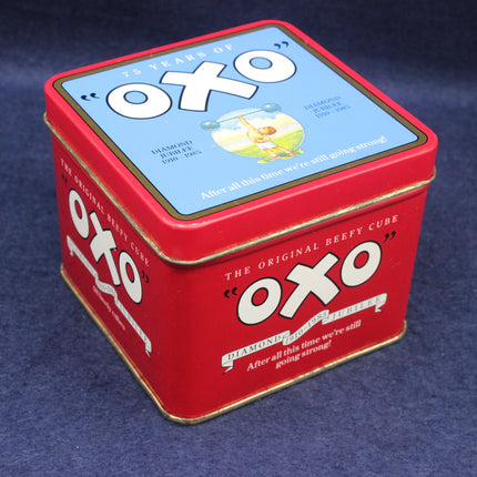 Red OXO tin on a dark blue background