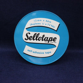 Blue container of Sellotape with white label on a dark blue background