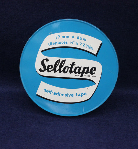 Blue container of Sellotape with white label on a dark blue background