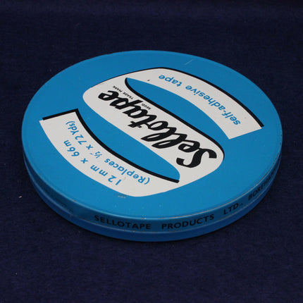 Blue tape roll with Selotape branding on a dark background