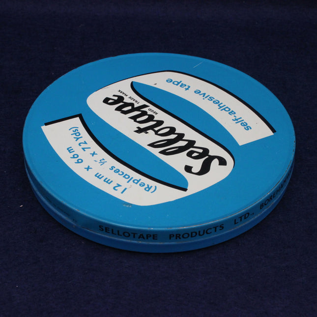 Blue tape roll with Selotape branding on a dark background