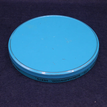 Blue circular object with text on a dark background