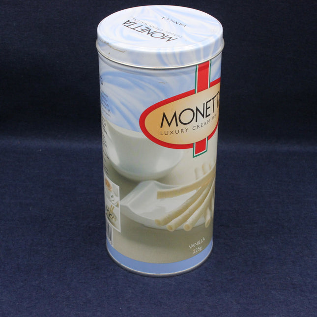 empty canister of Monette luxury cream on a dark blue background