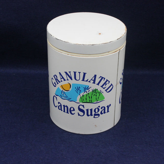 Granulated Cane Sugar container with branding on a dark background