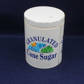 Granulated Cane Sugar container with branding on a dark background