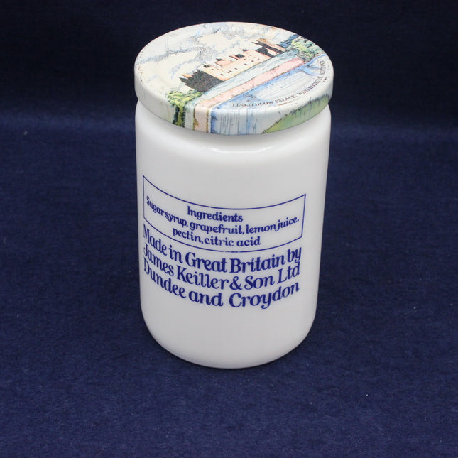 White jar with decorative lid on a dark blue background