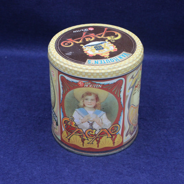 Vintage tin can with decorative lid featuring a child's portrait on a blue background