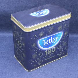 Tetley tea tin with 180th anniversary design on a blue background