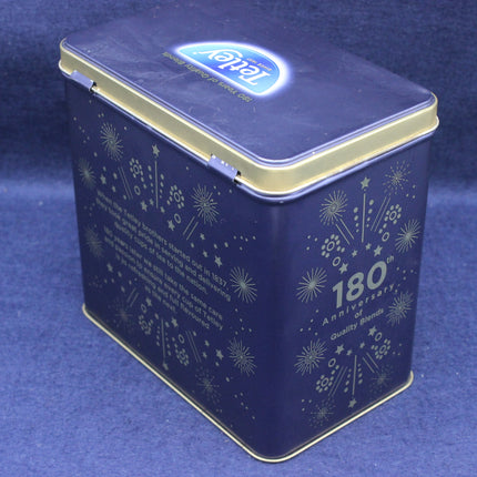 Blue tin box with Tetley Tea logo and 180th anniversary text on a blue background