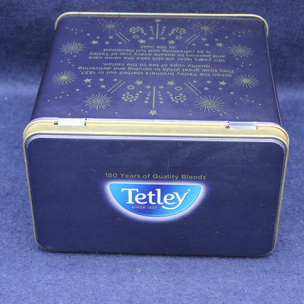 Blue Tetley tea tin with star patterns on a blue background