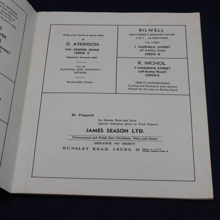 Page from a book or document with printed text and names on a black background