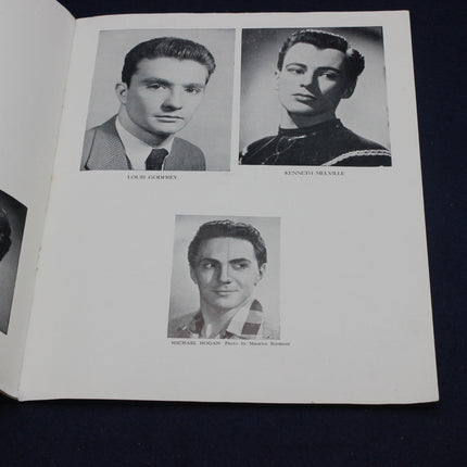 Page from a book with black and white portraits of three men.