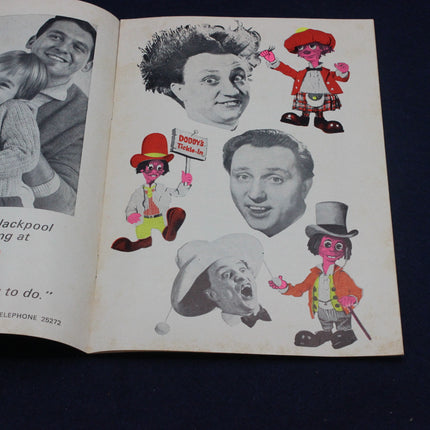 Open book with illustrations of a man, a cartoon character, and a toy figure on a dark background.