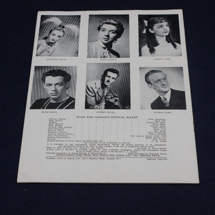 Vintage sheet with black and white portraits of a ballet company on a dark background