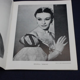 Black and white photo of a dancer in a formal gown on a book page.
