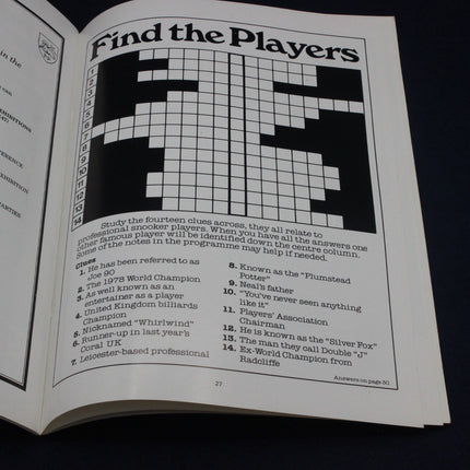 Open book with a crossword puzzle titled 'Find the Players' on a black background