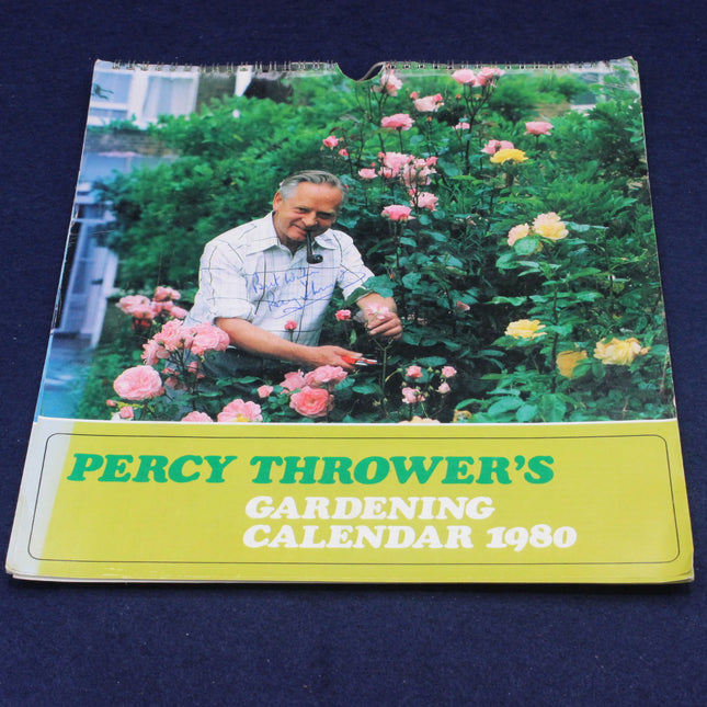 Percy Thrower's Gardening Calendar 1980 with a man gardening in a garden on a blue background