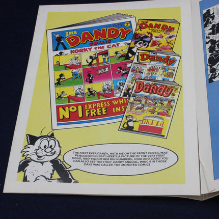 Comic book advertisement for 'The Dandy' featuring a cat character on a yellow background.