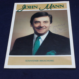 Souvenir brochure with a photo of John Mann on a dark blue background
