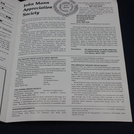 Open book with text on John Mann Appreciation Society and other societies.