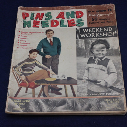 Vintage 'Pins and Needles' magazine cover with a couple and child on a blue background