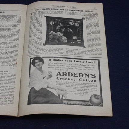 Open book with an advertisement for Arderne's Crochet Cotton on a dark background