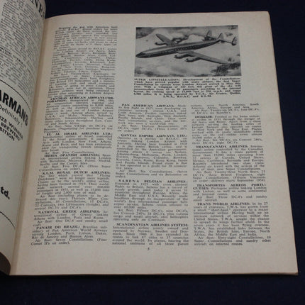 Open book with text and a black and white airplane illustration on a dark background