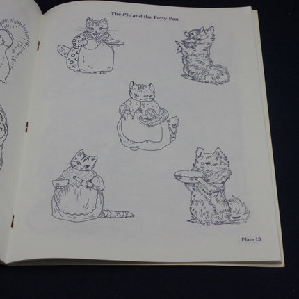 Page from a book with line drawings of cats in various poses on a white background.