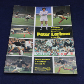 Soccer souvenir brochure featuring images of players and text on a blue background