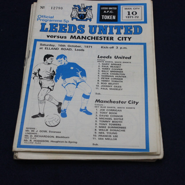 Football match programme for Leeds United vs Manchester City, featuring team lists and match details.