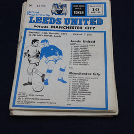 Football match programme for Leeds United vs Manchester City, featuring team lists and match details.