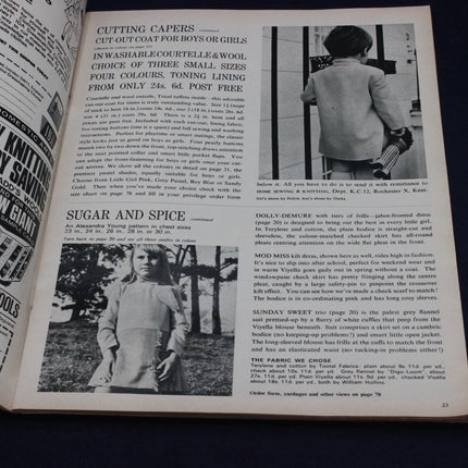 Open book with black and white photos and text on a black background