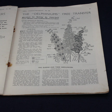 Open book with needlework pattern and instructions on a black background