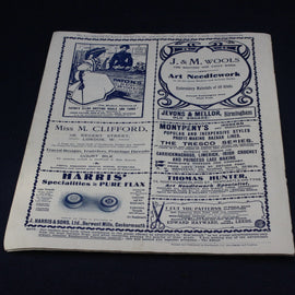 Vintage advertisement sheet with text and logos on a dark background