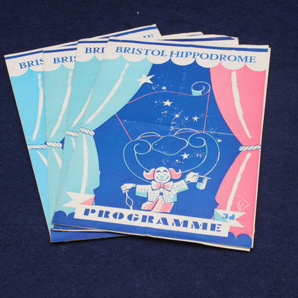 Stack of Bristol Hippodrome programmes with a clown illustration on a blue background